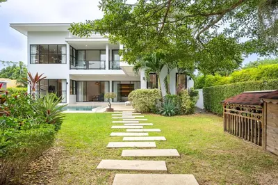 a house with a stone pathway in the yard at V212 One Of The Most Beautiful Villa In Phuket in Bang Tao Beach