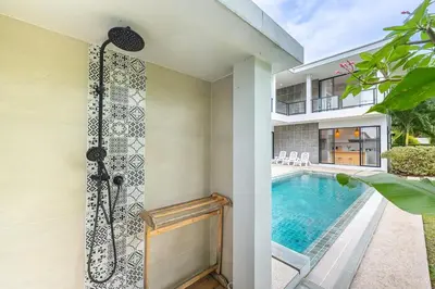 a bathroom with a shower and a swimming pool at V212 One Of The Most Beautiful Villa In Phuket in Bang Tao Beach