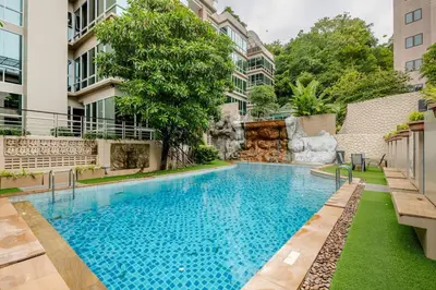 a swimming pool in the middle of a building at Karon View 2 Bed 5 Minutes walk to Karon Beach 11 in Karon Beach