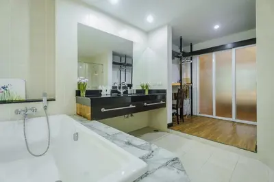 a bathroom with a tub and a sink at Karon View 2 Bed 5 Minutes walk to Karon Beach 13 in Karon Beach