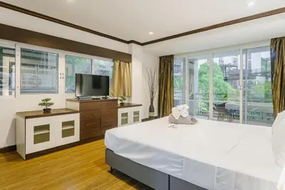 a large bedroom with a large bed and a television at Karon View 2 Bed 5 Minutes walk to Karon Beach 13 in Karon Beach