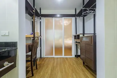 a room with a glass door and a wooden floor at Karon View 2 Bed 5 Minutes walk to Karon Beach 13 in Karon Beach