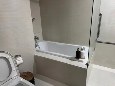 a bathroom with a bath tub and a toilet at Room in Rawai in Rawai Beach