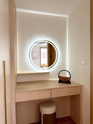 a bathroom with a mirror and a wooden vanity at Brand new apartment on Kamala in Kamala Beach
