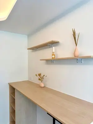 a kitchen with a wooden counter and shelves at Brand new apartment on Kamala in Kamala Beach