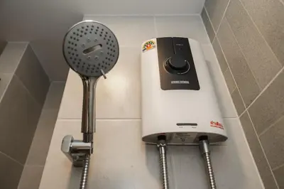 a hair dryer and a blow dryer on a wall at C213 Fit Chill Condo with Pool and Gym in Kathu