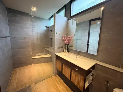 a bathroom with a sink and a shower at Rawai House 16 in Ban Saiyuan (1)