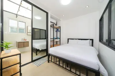a bedroom with a bed and a bathroom at Laguna Townhouse with private pool, Bang Tao Beach in Laguna Phuket
