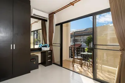 a kitchen with a large window and a balcony at Laguna Townhouse with private pool, Bang Tao Beach in Laguna Phuket