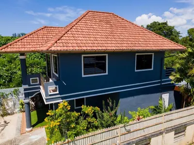a blue house with an orange roof at 3 Bed 3 Bath Villa 400m to Beach in Surin Beach