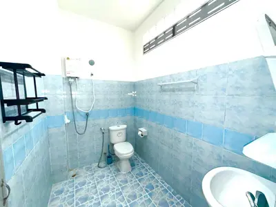 a bathroom with a shower and a toilet and a sink at Patong Canal Villa 104 in Patong Beach