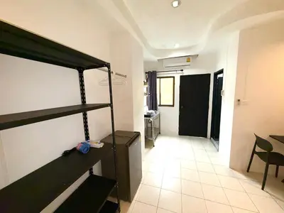 a room with a bunk bed and a hallway at Patong Canal Villa 105 in Patong Beach