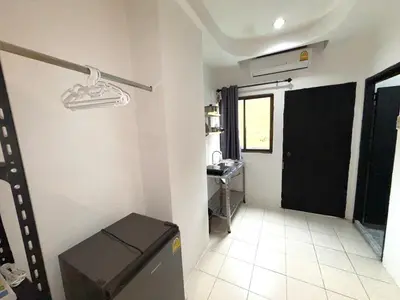 a bathroom with a black door and a sink at Patong Canal Villa 105 in Patong Beach