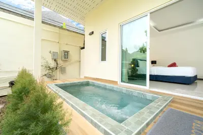 a swimming pool in the middle of a house at Oxavia Garden Oasis B3 in Nai Harn with Jaccuzzi in Rawai Beach