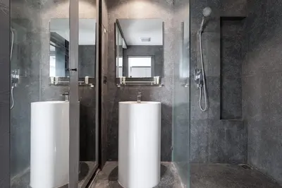 a bathroom with two urinals and a shower at Scenic Hill View Apartment CTG P609 in Tropics Kamala residence, Great Facilities, Close to Beach and Fantasea in Kamala Beach