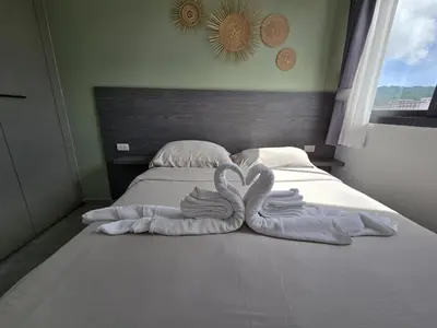 two swans towels sitting on top of a bed at Modern Retreat 1- BedT3-529 in Chalong