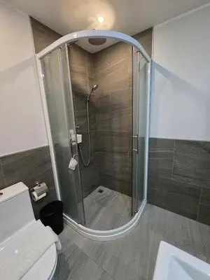 a shower with a glass door in a bathroom at Modern Retreat 1- BedT3-529 in Chalong
