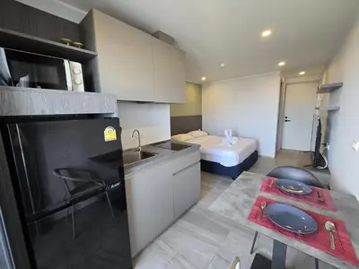 a small kitchen with a sink and a refrigerator at Blue Edge Studio T3-527 in Chalong