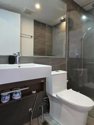 a bathroom with a toilet and a sink and a shower at Modern Studio Apt T3-526 in Chalong
