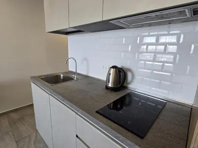 a kitchen with a sink and a tea kettle on a counter at Modern Studio Apt T3-526 in Chalong