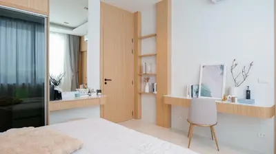 a bedroom with a bed and a desk and a chair at Relax Nai Yang beach pool Villas in Nai Yang Beach