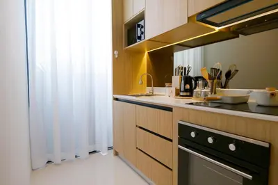 a kitchen with a sink and a stove at Relax Nai Yang beach pool Villas in Nai Yang Beach
