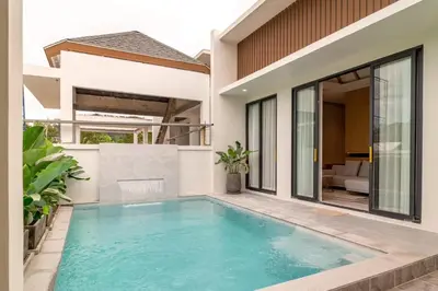 a swimming pool in the backyard of a house at Relax Nai Yang beach pool Villas in Nai Yang Beach