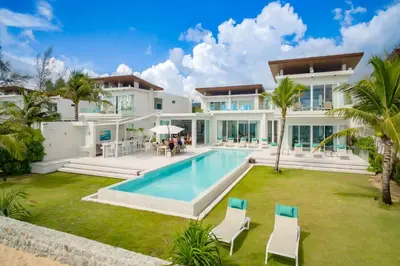 an exterior view of a villa with a swimming pool at Baan Kloi II in Ban Na Tai