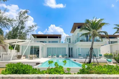 a house with a swimming pool in front of it at Baan Kloi IV in Ban Na Tai