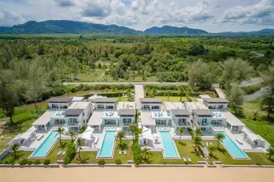an aerial view of a large house with a pool at Baan Kloi in Ban Na Tai
