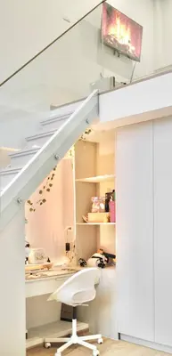 an office under the stairs with a white chair at COMFORTABLE RENOVATED 2BR TownHouse5 MonkeyHill in Ban Sam Kong