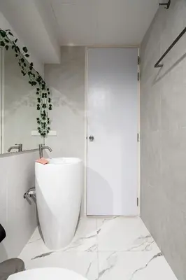 a bathroom with a white tub and a sink at COMFORTABLE RENOVATED 2BR TownHouse5 MonkeyHill in Ban Sam Kong