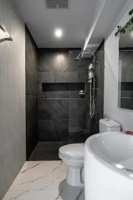 a bathroom with a toilet and a sink and a tub at COMFORTABLE RENOVATED 2BR TownHouse5 MonkeyHill in Ban Sam Kong