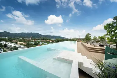 a large swimming pool on top of a building at Fairway Escape - Golf View 1BR with Balcony in Laguna in Laguna Phuket