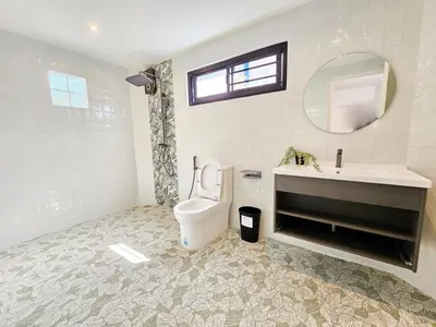 a bathroom with a toilet and a sink and a mirror at 2 Bedroom Pool Villa in Kamala in Kamala Beach