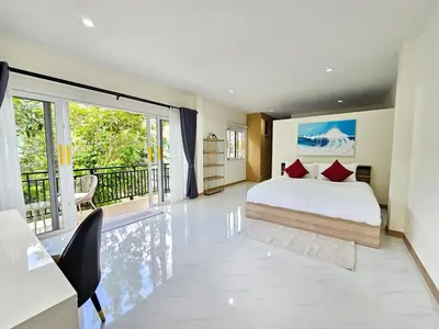 a bedroom with a bed and a balcony at 2 Bedroom Pool Villa Green View in Kamala Beach