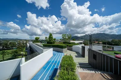 a view from the balcony of a house at Skypark Laguna Garden View Bang Tao Beach in Laguna Phuket