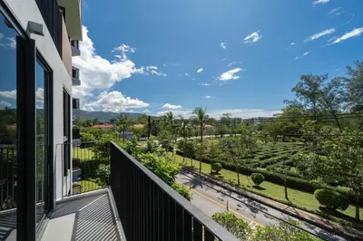 a balcony with a view of a street at Skypark Laguna Garden View Bang Tao Beach in Laguna Phuket
