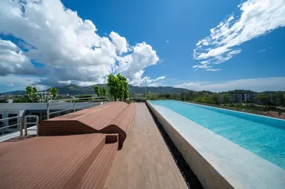 a swimming pool on the roof of a building at Skypark Laguna Bang Tao Beach in Laguna Phuket