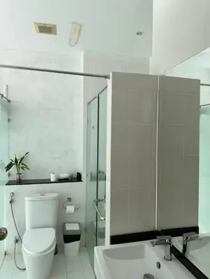 a bathroom with a toilet and a shower and a sink at Grand kamala falls in Kamala Beach