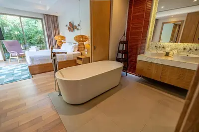 a bathroom with a bath tub and a bedroom at Villa Allamanda 3 Bdrm Best Location Bangtao Beach VVPHU88 in Phuket