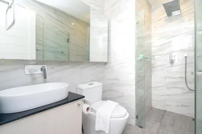 a bathroom with a toilet and a sink and a shower at Prime Location Kamala Ocean View Suite OCN C64 just 450m to the Beach in Kamala Beach
