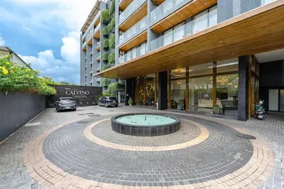 a building with a fountain in front of a building at C214 Condo Seaview Pools Gym Walk to Rawai Beach in Rawai Beach