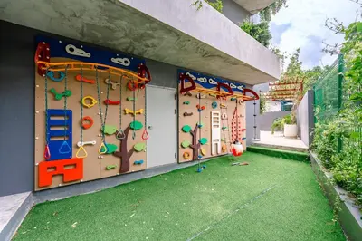 a play room with a climbing wall and a play yard at C214 Condo Seaview Pools Gym Walk to Rawai Beach in Rawai Beach