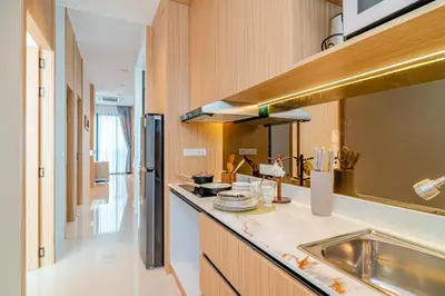 a kitchen with a sink and a counter top at Narinsaya Pool villas in Nai Yang Beach