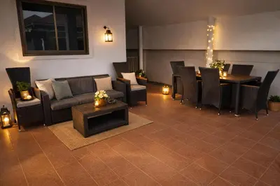 a living room with a couch and a table and chairs at Villa Lilly in Rawai Beach