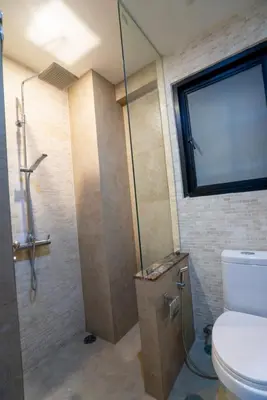 a bathroom with a shower and a toilet in it at Laguna Luxure Private Pool Villa in Layan Beach