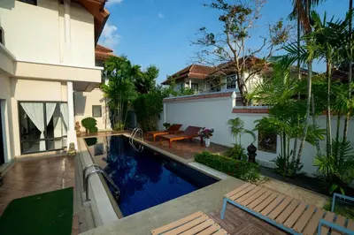 a swimming pool in the backyard of a house at Laguna Luxure Private Pool Villa in Layan Beach