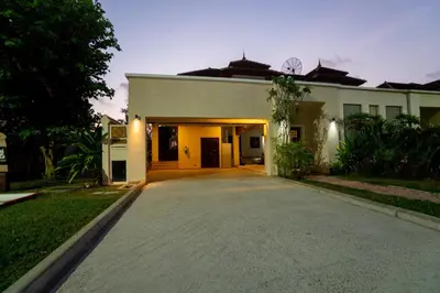 a house with a driveway in front of it at Laguna Luxure Private Pool Villa in Layan Beach