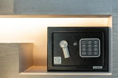 a small box with a key in a drawer at Suite Altair 2BRPool RooftopBarCitygate Kamala in Phuket Town